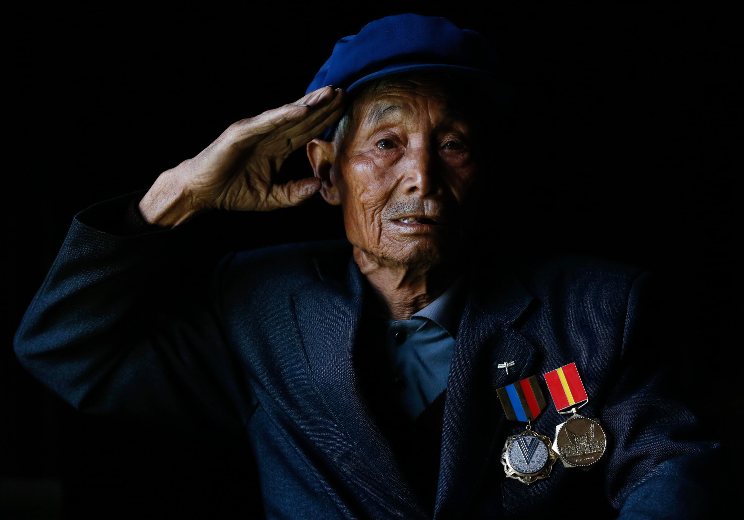 杨体伍，1924年生，16岁参军，多次与日寇作战。抗战胜利后返乡，现住云南省腾冲县明光镇松园村。（2014年2月摄）